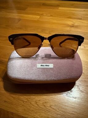 Miu Miu Black Frame Sunglasses with Brown Lenses and Gold details